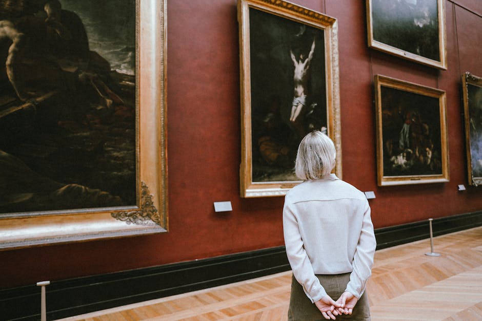 Golden Triangle Madrid museums — visitor observing paintings in art gallery