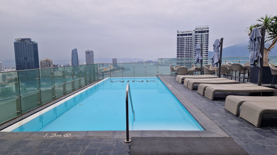 Luxury hotels Madrid Spain rooftop pool with skyline view