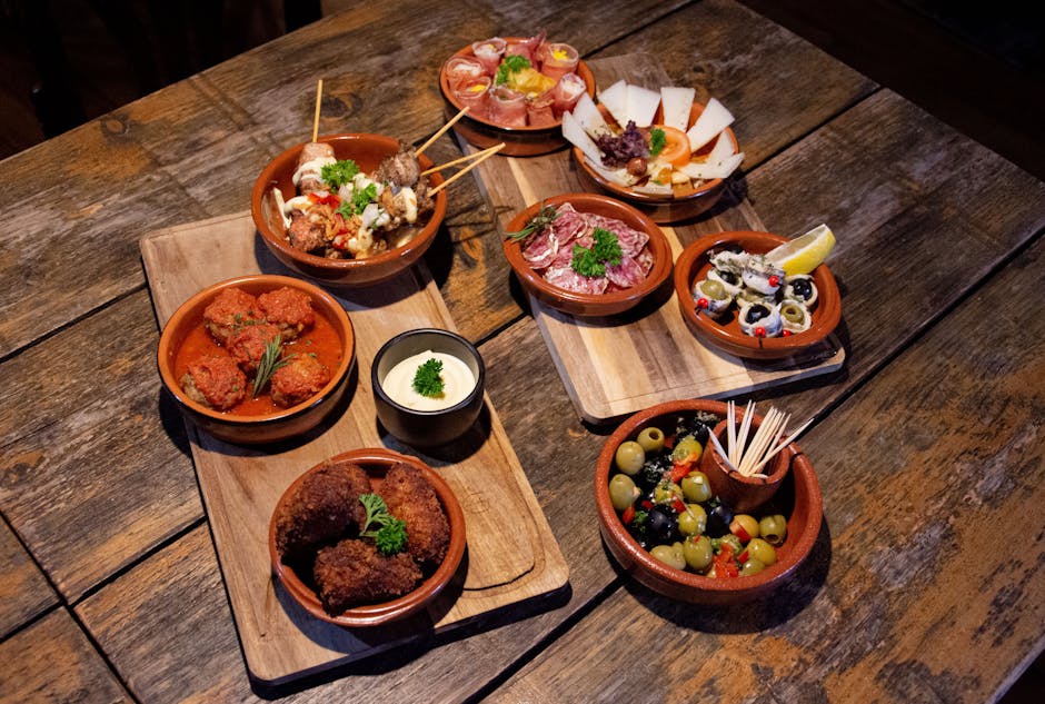 Tapas bars La Latina Madrid — assortment of traditional tapas on wooden boards
